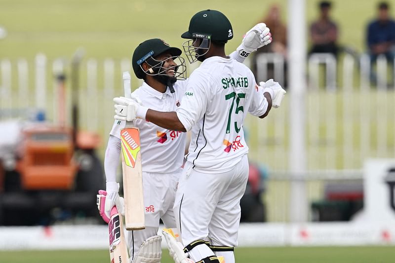 Bangladesh’s Mushfiqur Rahim (L) and Shakib Al Hasan celebrate after winning the second and last Test cricket match between Pakistan and Bangladesh, at the Rawalpindi Cricket Stadium in Rawalpindi on 3 September 2024